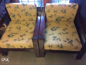 Two Beige And Green Padded Brown Wooden Armchairs