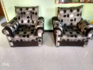 Two Gray And Black Polka Dot Print Sofa Chairs
