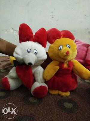 Two Yellow And White Animal Plush Toys