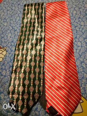 2 branded tie in new condition one red and other