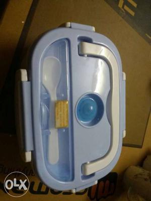 Baby's Blue Plastic Food Container And Spoon
