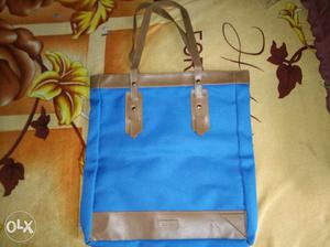 Brand new Blue bag from Avon. Original price %off