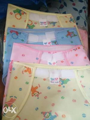 Four Yellow, Pink And Blue Diaper Covers
