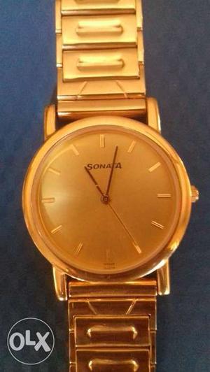 Golden colour branded chain watch