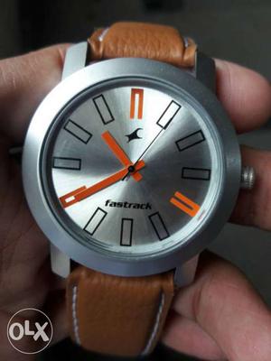 Round Grey And Orange Fastrack Watch With Brown Leather Band