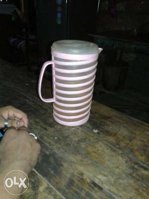 White And Pink Plastic Pitcher