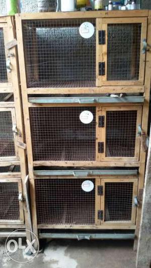 Wooden cages available for sale.