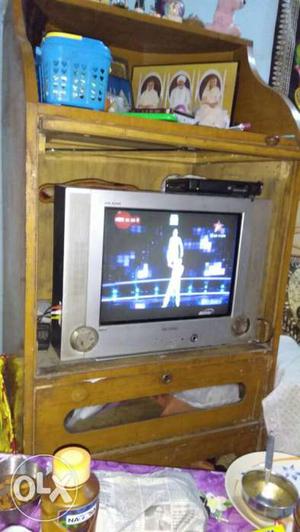 Brown Wooden TV Hutch; Grey Widescreen CRT Television