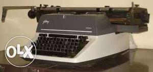 White And Blue Mechanical Typewriter