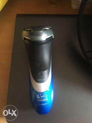 Blue And Black Philips Battery-powered Rotary Shaver
