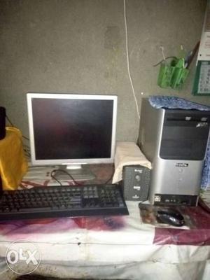 Gray And Black Computer Monitor, Keyboard, Mouse And Tower