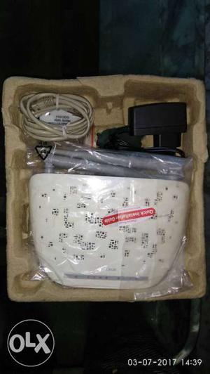 White Wireless Router In Box