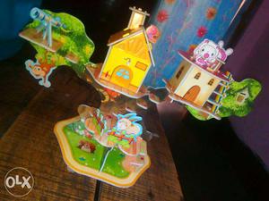 Yellow, Red, Green, And Pink Tree House Standee