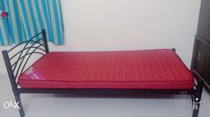 Black Metal Bed Frame With Red Mattress