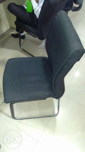 Black Padded Armless Chair'