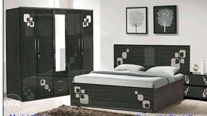 Black Wooden Frame Bed With Gray Beddings