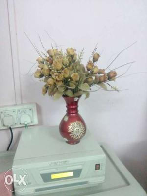 Brown Flowers In Red Vase