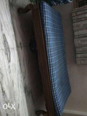 Brown Wooden Bed With Blue Mattress