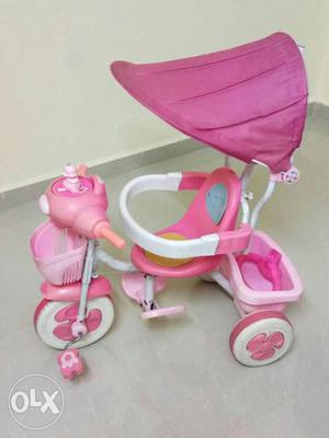 Children Pink And White Tricycle