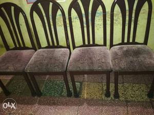 Four Brown Wooden Framed Fabric Padded Chairs