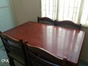 Rectangular Brown Wooden Table With Chairs