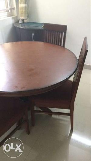 Round Brown Wooden Dining Table