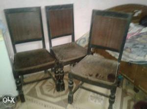 Three Brown Wooden Dining Chairs