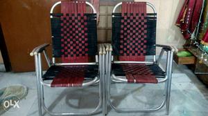 Two Gray Metal Folding Deck Chairs