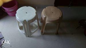 Two White And Brown Plastic Stools