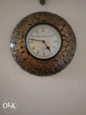 Wall clock with real Indian coins embossed in it. Original
