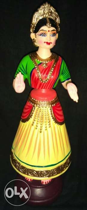 Woman In Red, Green, And Yellow Dress Figurine
