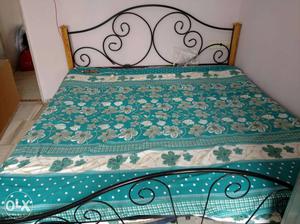 Wrought iron bed (king size) with mattress.
