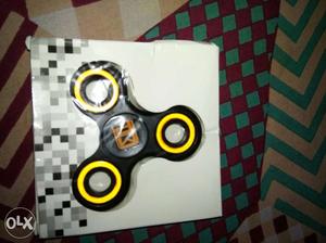 Yellow And Black Three-bladed Fidget Spinner In Box