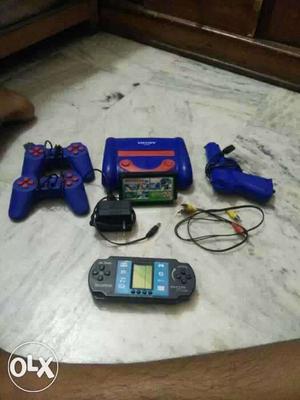 Black Portable Game Console And Blue Game Pad Controller