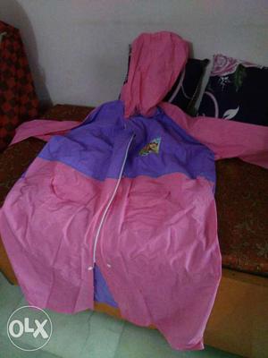 Brand new raincoat for school children in