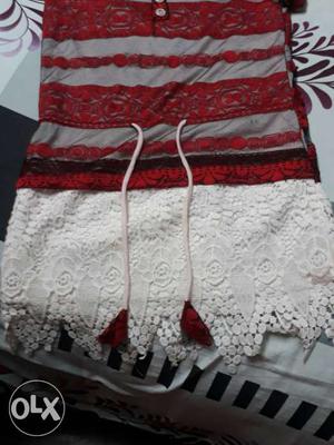 Red, Gray, And White Knitted Textile