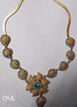 A Brand New gold plated long haram necklace set with earings
