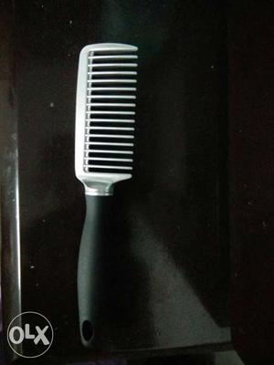 Brand new silver and black colour comb