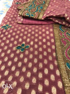 Fine maroon brocade sari with beautiful butie