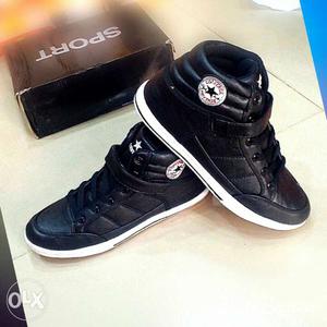 Pair Of Black-and-white Converse High Top Sneakers