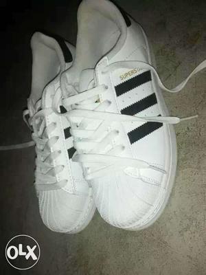 Pair Of White Adidas Superstar Low Top Shoes