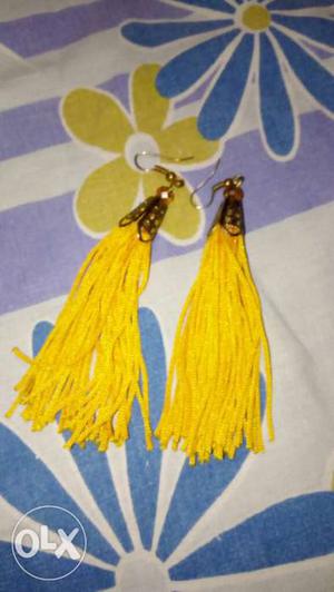 Pair Of Yellow And Gold Earrings having thread design