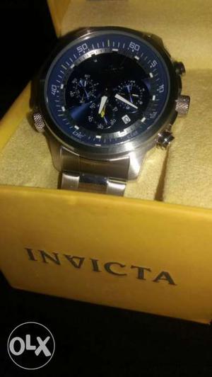 Round Black Chronograph Invicta Watch With Silver Case And