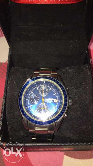 Round Silver And Blue Chronograph Watch With Silver Straps