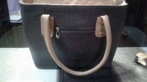 This is a pure leather shoulder bag and has a