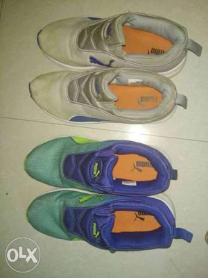 Two Pair Of Gray And Green Puma Low Top Athletic Shoes