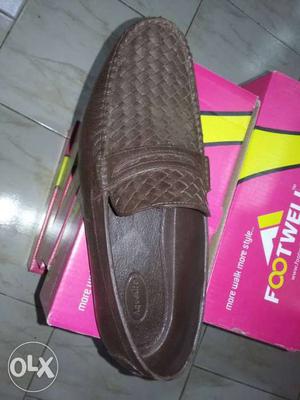 Unpaired Brown Leather Penny Loafer On Box