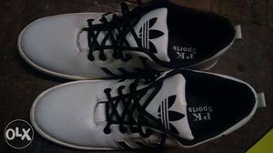 White-and-black Adidas PK Sports Shoes