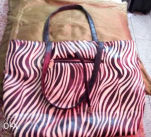 Zebra print handbag.