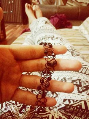 A black designer choker and cheap